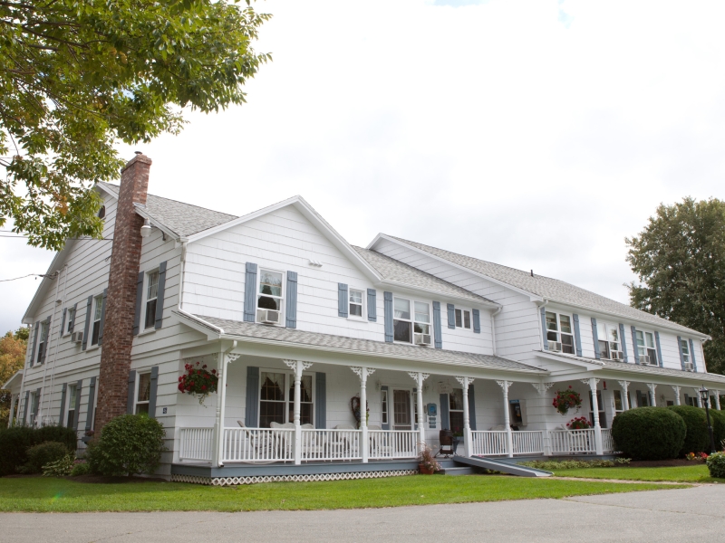 Outside view of the large wooden white structure that is the Kindred spirits Country Inn