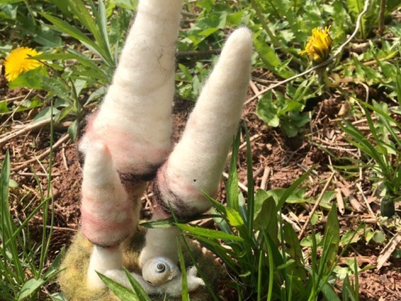 picture of felt art created sitting in the grass