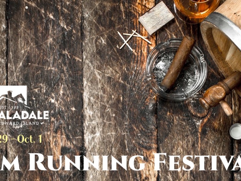 poster with dates, set on a background of a wooden surface, rum barrel and ashtray with cigar