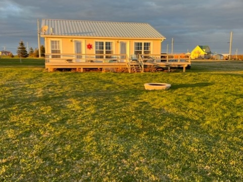 outside picture of a yellow cottage. the sands at Darnley