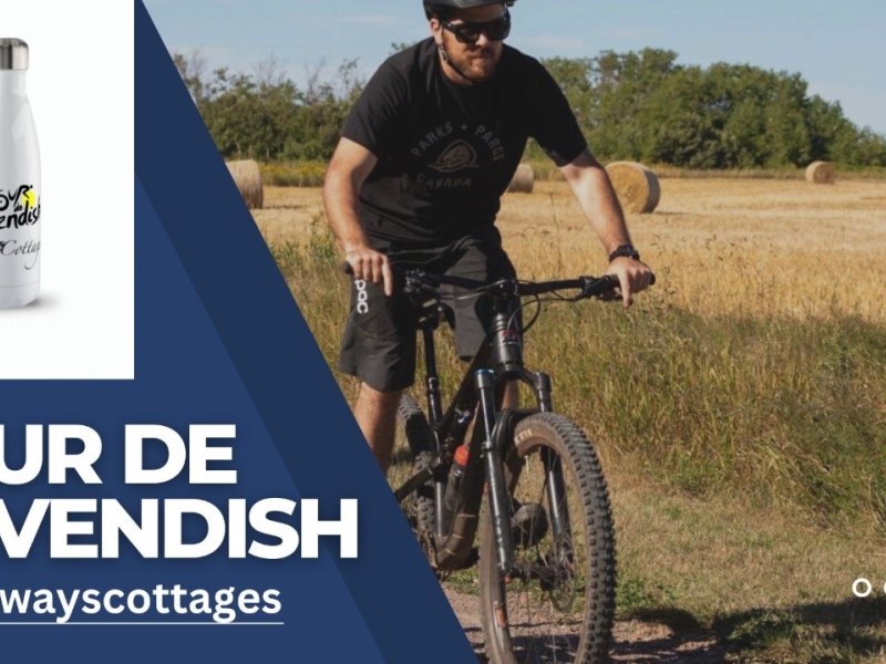 One gentleman Cycling along beside a field of fresh cut hay.