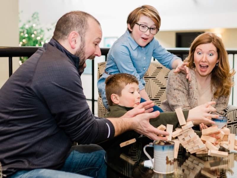 Family playing a game of Jenga