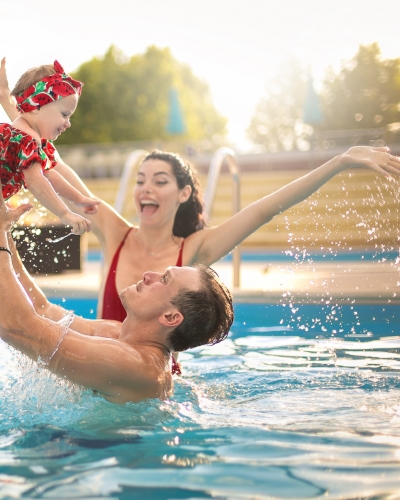 Family of three in the pool