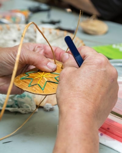 Close-up of hands doing quill work, Lennox Island, PEI