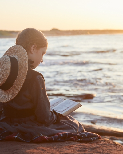Anne of Green Gables reading on the beach