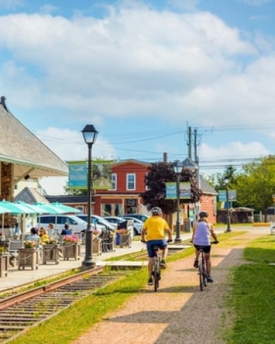 Two cyclists on Confederation Trail through Kensington, PEI