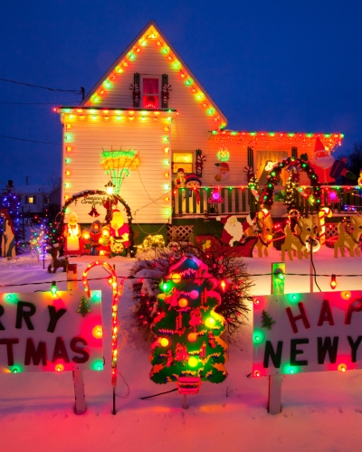 Small house decorated with holiday lights