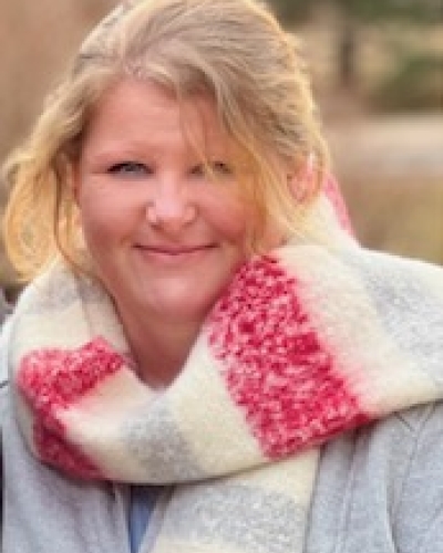 Profile of Amy Stewart in colourful scarf