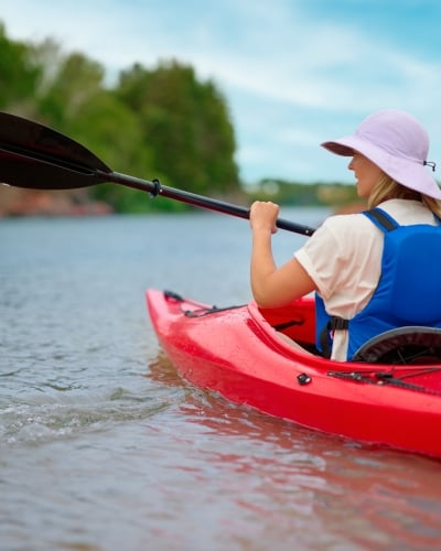 Woman in kayak at Basin Head, PEI