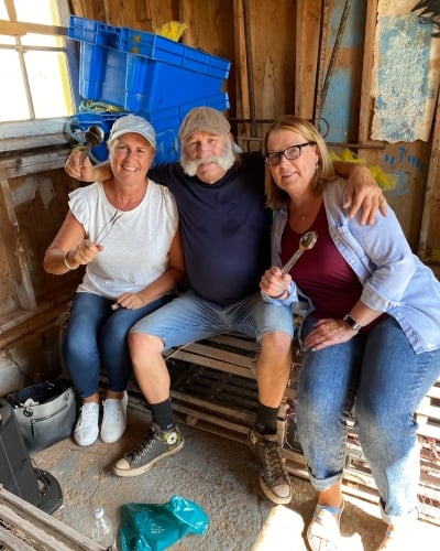 Brendon Peters with visitors in his family fish shack