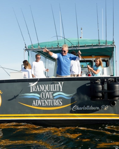 Family onboard fishing vessel fishing mackerel