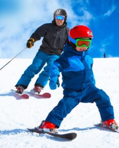 Parent and child skiing