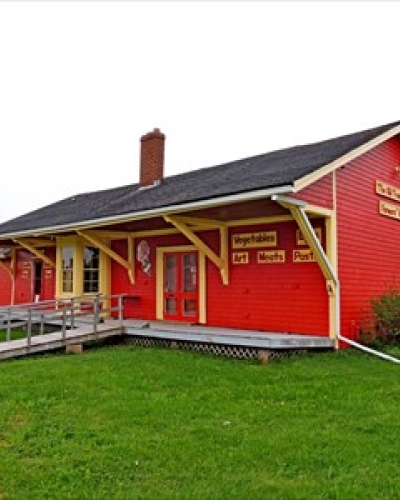 outside photo looking at the red building of the Cardigan Train Station