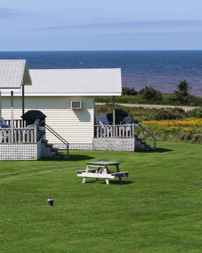 Three white cottages with ocean view, PEI