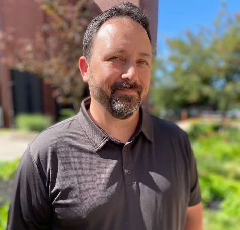 Portrait image of Doug Dennis standing outdoors at PAB