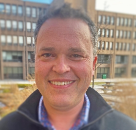 Image of Joe Coade standing in PAB courtyard