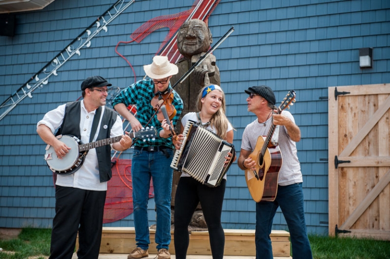 Group of four people playing instruments