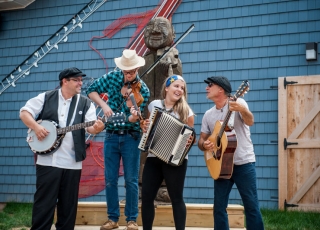 Group of four people playing instruments