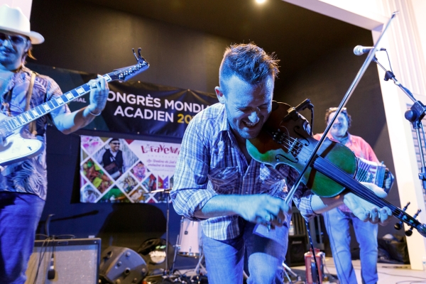 Acadian Abram Village, blue light, performers, musicians, fiddle  