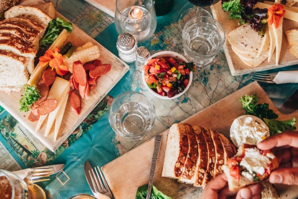 Bread and cheese boards at table