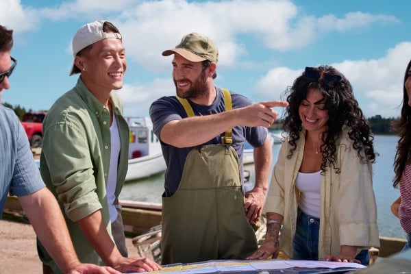 Local fisher gives directions to tourists at French River Harbour, PEI