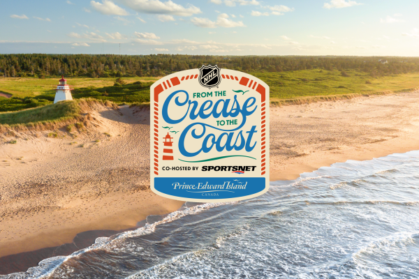 Aerial view of St. Peter's Lighthouse and beach with "Crease to Coast NHL Summit" logo in center