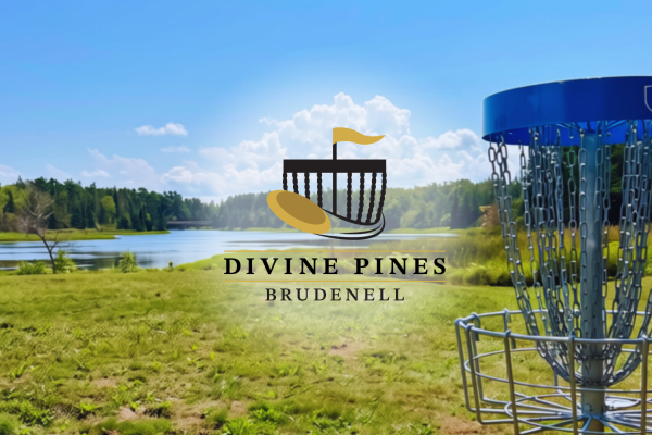 Disc golf basket in foreground and water in background