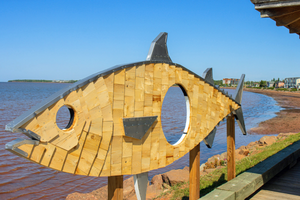 Holy Mackerel art installation stands along waterfront in Summerside on a summer day