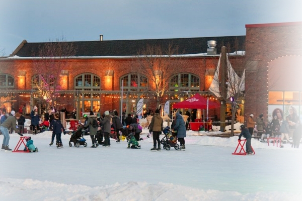 Skating on outdoor rink at Founder's Hall at night
