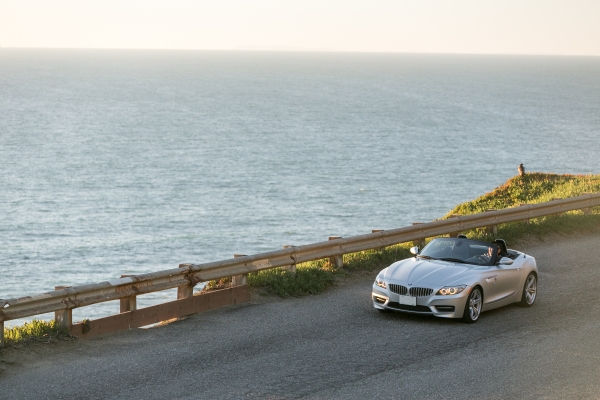 Image of car driving along coastline