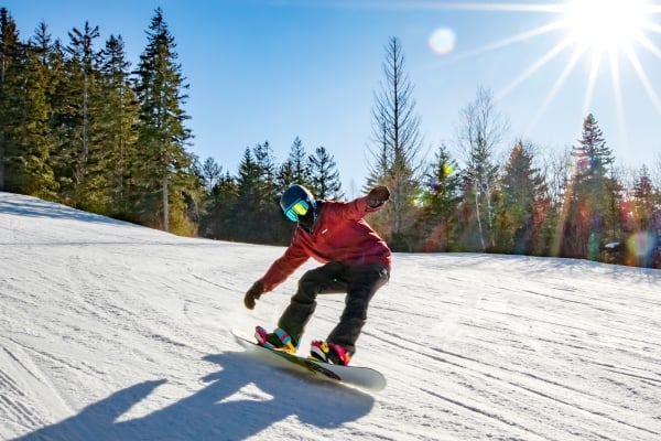 Snow boarder on sunny winter day at Brookvale Ski Park