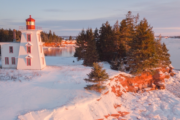 Aerial view of Block Lighthouse and red cliffs in winter