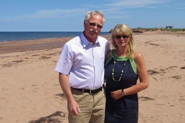 Sandi Lowther with spouse on a beach