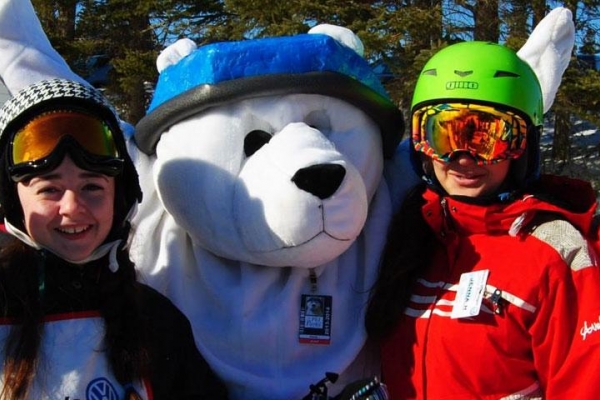 Group of kids with bear mascot