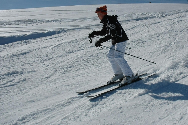 Image of female skiing downhill - pixabay
