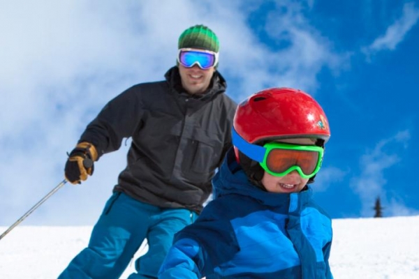 Parent and child skiing