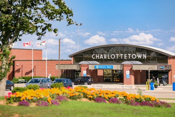 Exterior view of Charlottetown Airport (YYG) Departures entrance in summer