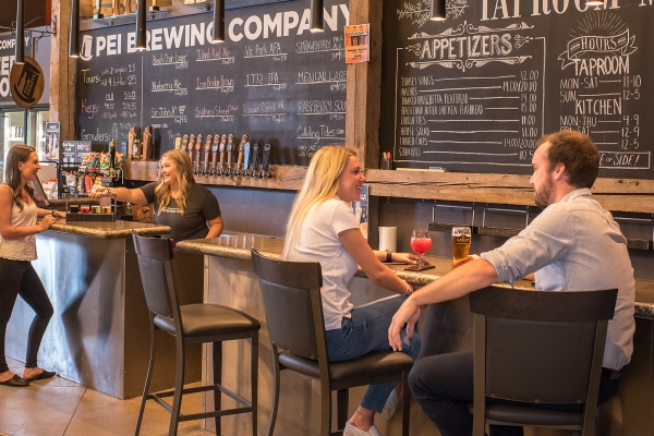 PEI Brewing Company, bar, people sitting, beer, chalkboard menu