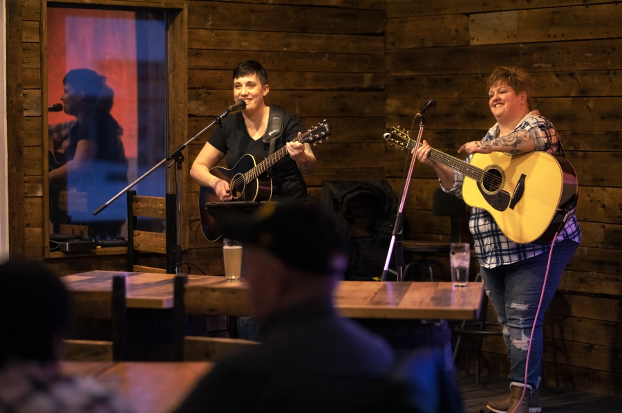 Two female musical entertainers on stage at Lone Oak Brewery