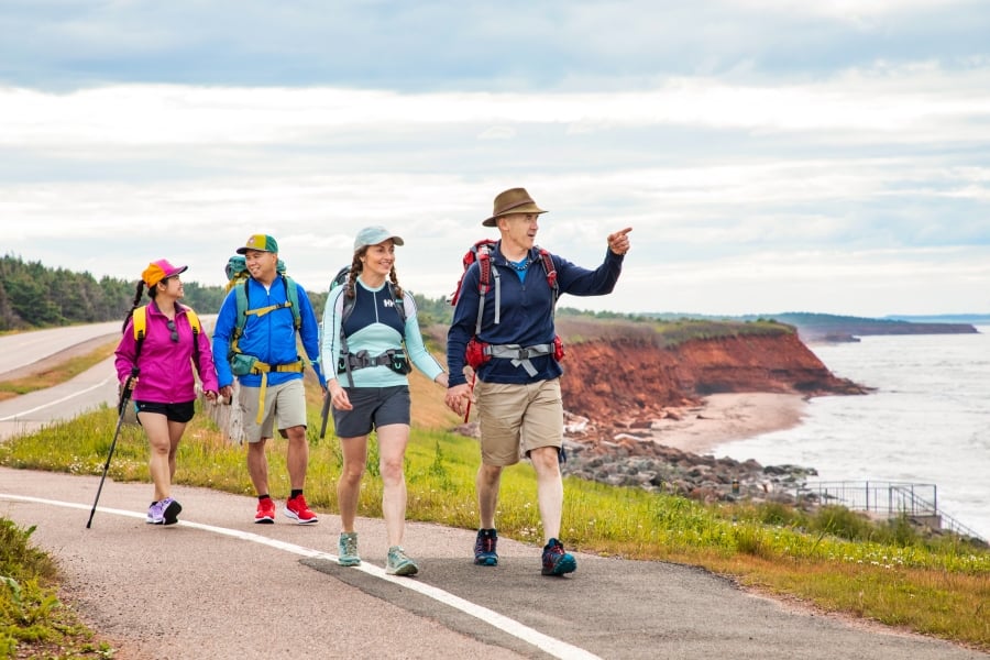 Group of 4 on Island Walk route in PEI National Park, near Orby Head