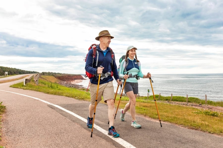 Couple hiking along Gulfshore Parkway in PEI National Park on the Island Walk route