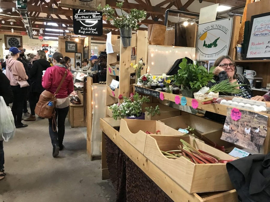 people wandering the many stalls at the Charlottetown Farmers Market