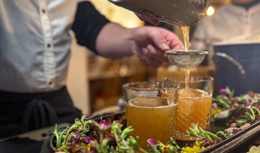 Chef pours drinks through sieve at Inn at Bay Fortune