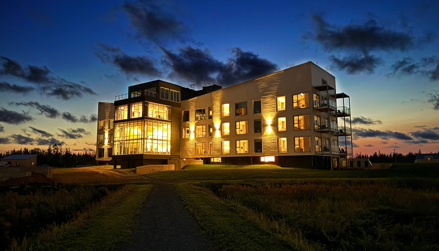 Hotel Acadia at Blackbush Beach Resort The Hotel Acadia at Blackbush Beach Resort at night