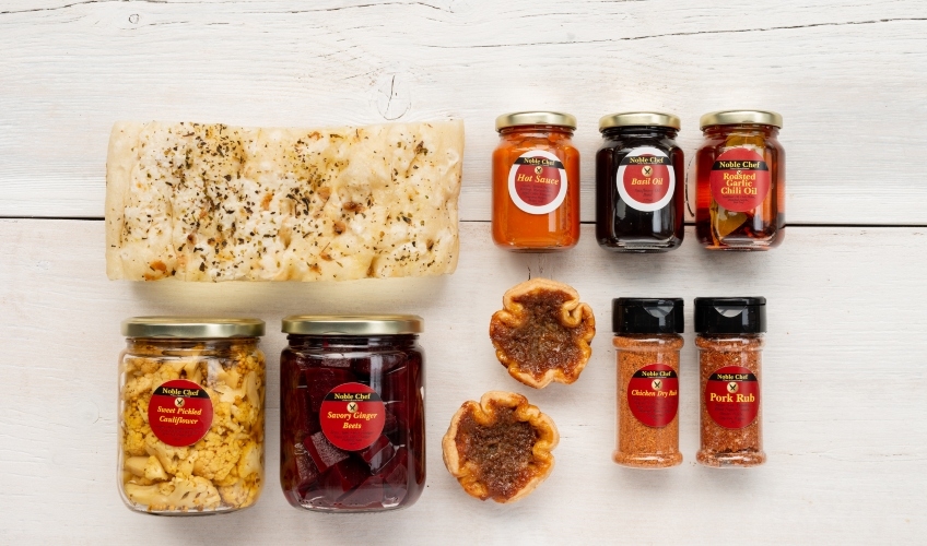 Display of Noble Chef PEI products: spice blends, pickles and sauces