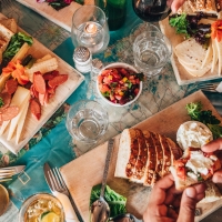 Bread and cheese boards at table