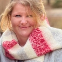 Profile of Amy Stewart in colourful scarf