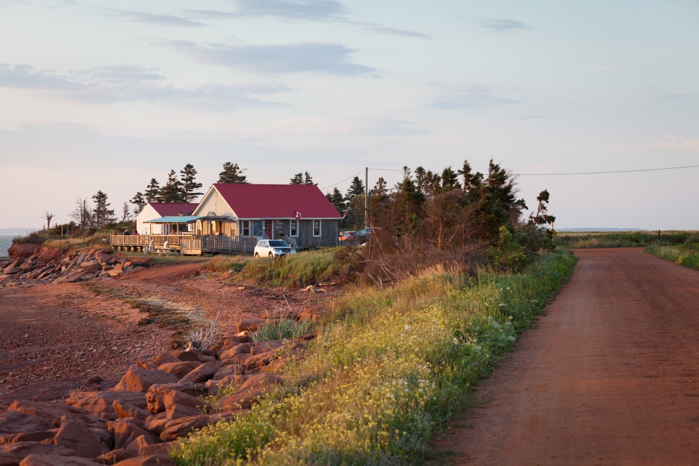 Point Prim Chowder House, PEI Point Prim Chowder House pictured to the left of red dirt road