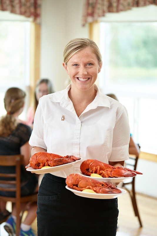 New Glasgow Lobster Suppers Waitress at New Glasgow Lobster Suppers serving cooked lobster