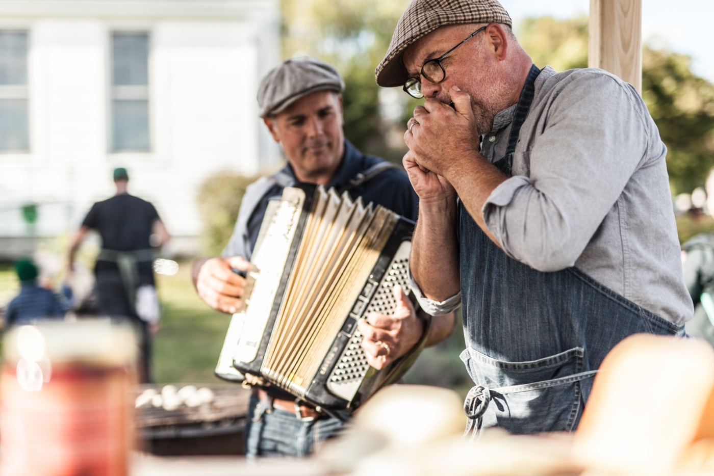 Musicians play accordian and harmonica at event